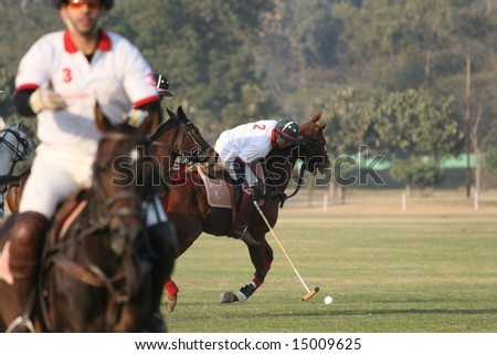 DELHI - JANUARY 2008: Polo players from the India Army (in red) square off against those from \