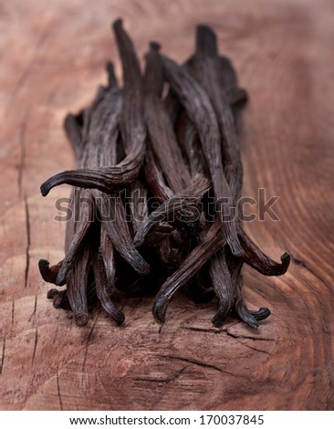 Vanilla pods on wooden background