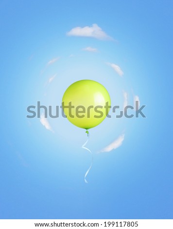 Green balloon like earth planet with ribbon flying into the sky.