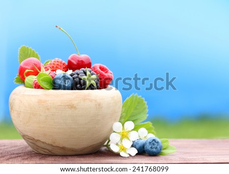 Summer berry fruits in bowl.