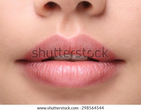 Part of face,young woman close up. Sexy plump lips without makeup
