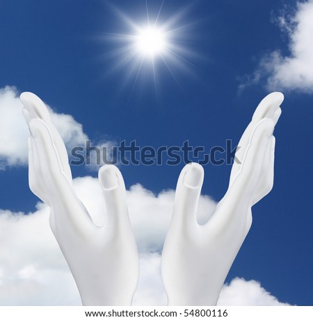 Hands reaching out  the sun