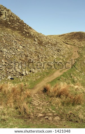 Winding path on Hadrian\'s wall in Northumberland, England.