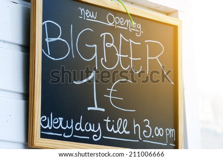 Close up of blackboard advertising beer prices outside a bar in Corralejo Fuerteventura