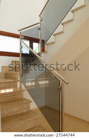 A modern marble staircase in the interior of a spanish villa