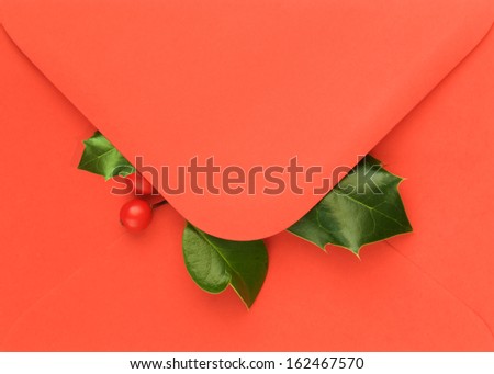 Red open flap envelope with Holly