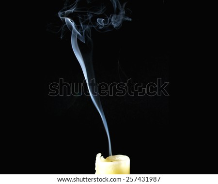 snuffed candle with smoke