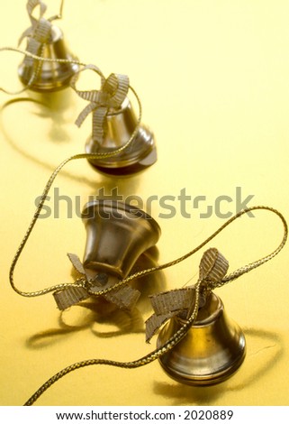 Christmas bells in a line on gold