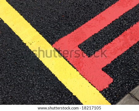 Red and yellow  road lines on new road