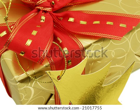 Gold gift box with red ribbon