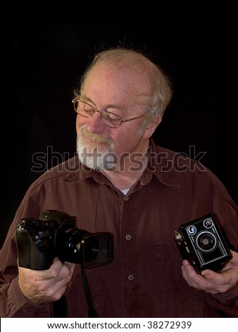Photographer with vintage and modern cameras