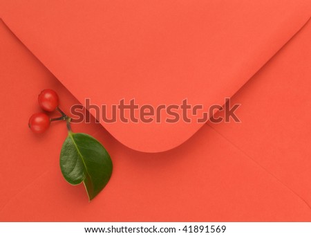 Red open flap envelope with Holly