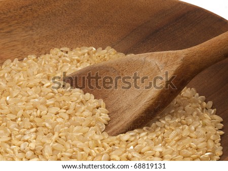 Wooden bowl of short grain brown rice