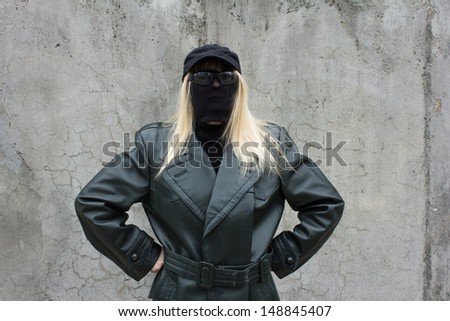 Anonymous woman with sunglasses and leather jacket