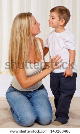 A young mother and son having fun together
