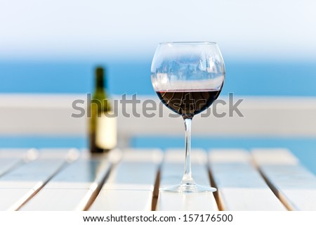 A Glass of Wine at the beach, standing on a footbridge in the south pacific