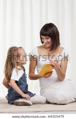 Mom playing with little daughter