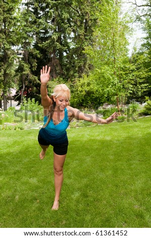 Young Woman Peforming Gymnastics