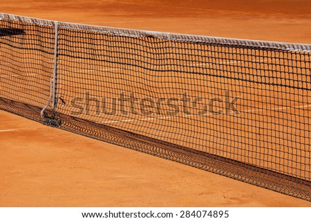 Tennis net on the clay court.