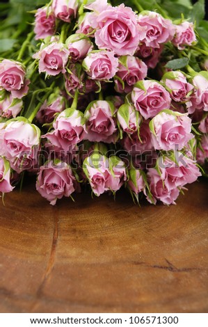 Big Roses Bouquet with wooden board texture