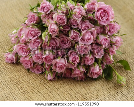 Big Roses Bouquet on sackcloth textured background