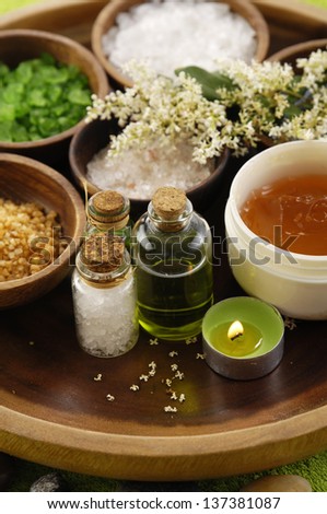 color sea salt in wooden bowl with oil ,salt in glass on wooden bowl