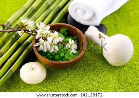 Cherry flower with salt in bowl ,candle, towel, bamboo grove a on towel