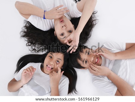Happy family with heads together on the floor