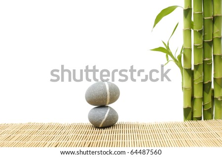Zen stone with bamboo grove on bamboo stick straw mat