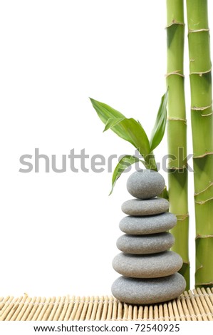 Stacked of stones with bamboo grove on bamboo stick straw mat