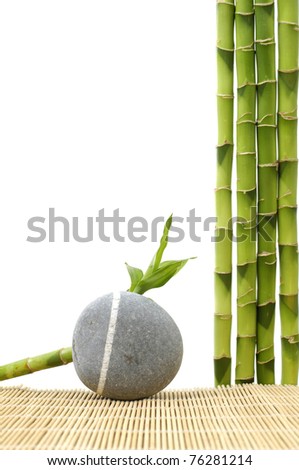 Zen stone with bamboo grove on stick straw mat