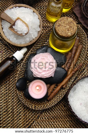 Spa wellness products –,massage oil ,stones, bowl of Spa salt on burlap mat