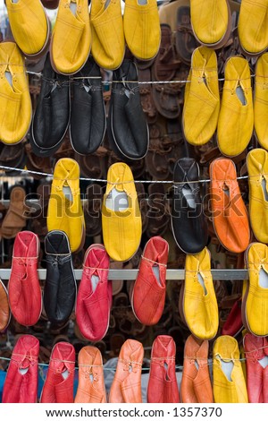 Yellow and red shoes in an abstract composition in a street market