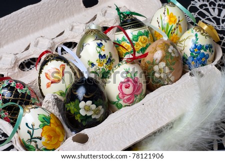 Colorful hand-painted eggshells stored in carton, Easter decoration
