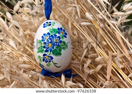 Delicate Easter decoration, genuine eggshell with hand painted blue flowers.