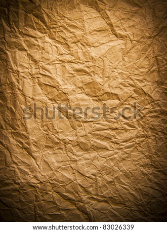 Dark crumpled page of vintage paper texture