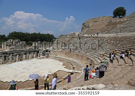 EPHESUS, TURKEY - AUGUST 10, 2015: Tourists in theatre in the ancient city of Ephesus, located in southwest Turkey.