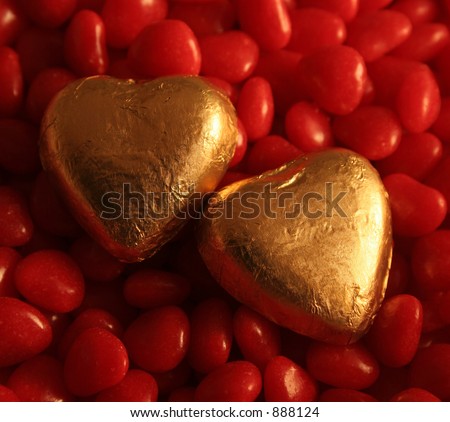 Golden Foil wrapped chocolate hearts set against cinnamon hearts.