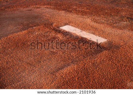 A closeup of the rubber on the pitchers mound.