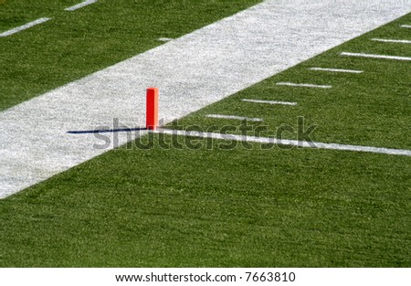 A shot of the endzone showing the goal line and the orange marker.