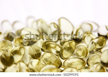 Yellow gel capsules with medicine in them.