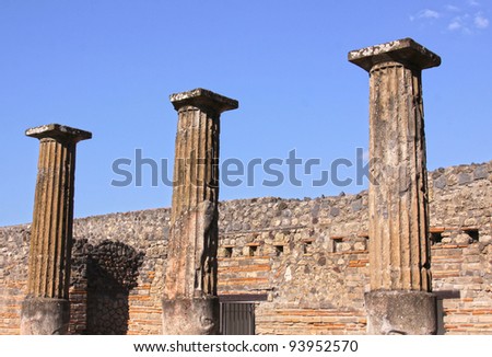Three large preserved columns in the Roman city of Pompeii.  It was completely buried by an eruption of Mount Vesuvius in AD 79.