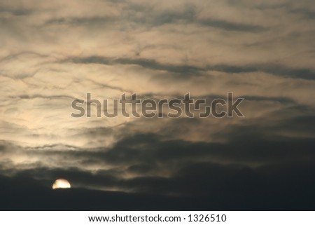 Evening sky with sun and clouds