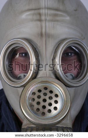 A portrait of a man with an old gas-mask