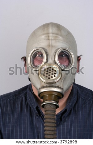 A portrait of a man with an old gas-mask