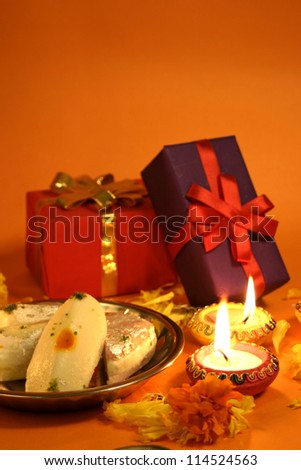 Diwali festival celebration with gifts sweets and lamps Diwali festival celebration with gifts sweets and lamps