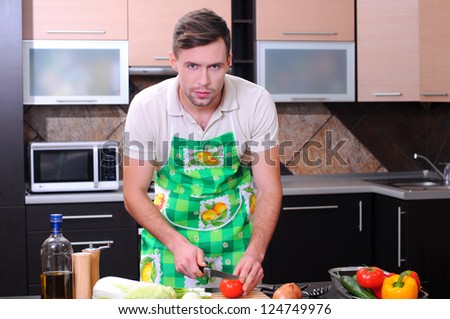 Man in kitchen preparing dinner