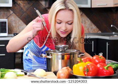 kitchen woman making healthy food standing happy smiling in kitchen preparing salad