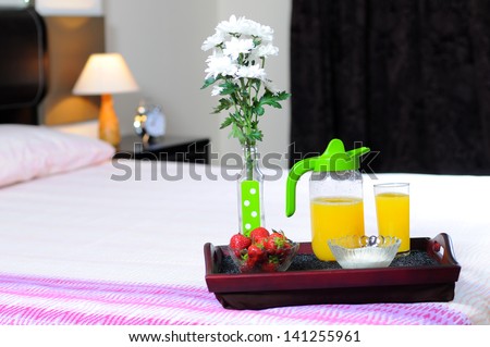 Breakfast in bed at a hotel room