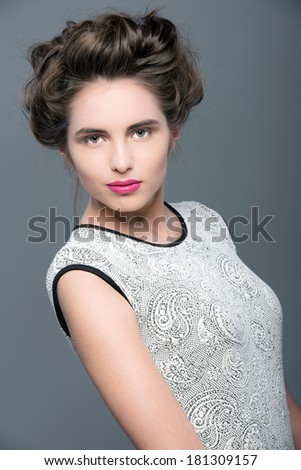 Glamour Fashion Woman Portrait. Studio shooting. Gray background